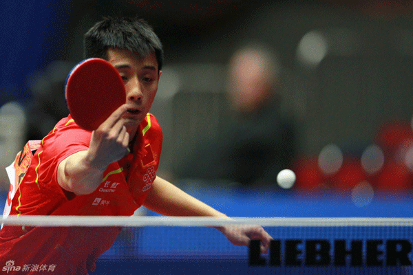 Zhang Jike of China returns a ball to Konstantinos Papageorgiou of Greece in the men's event at the World Team Championships in Dortmund on March 25, 2012.