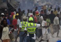 Haitian police patrol at a street in Haitian capital Port-au-Prince on Jan. 16, 2010. The situation in Haiti is worsened by occasional looting in the aftermath of a devastating earthquake on Jan. 12. (Xinhua/David de la Paz) 