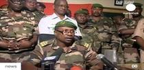 This TV grab image taken from Euronews channel shows Gokoye Abdul Karimou, spokesman for the millitary junta, delivering a televised statement in Niamey, February 19. Niger's new military rulers posted tanks and trucks mounted with machine guns around the presidential palace Friday after toppling strongman Mamadou Tandja and sacking the government in a deadly coup. (Xinhua photo)