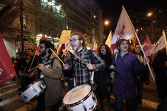 Greek demostrators shout slogans during a protest march against the austerity measures announced by the government in central Athens, capital of Greece, March 4, 2010. The Greek government ruled out on Thursday any possibility of backing off from an austerity plan it announced on Wednesday to fight the deficit, despite a string of protests against the measures. [Marios Lolos/Xinhua]