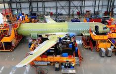 Chinese-made wings are installed to an Airbus A320 plane at Airbus (Tianjin) Final Assembly Co. Ltd in Tianjin, north China, March 16, 2010. The first pair of wings of Airbus A320 made in China, produced by Aviation Industry Corporation of China (AVIC) Xi'an Aircraft Industry Factory, were installed to the Airbus A320 plane in Tianjin on Tuesday. [Xinhua photo]