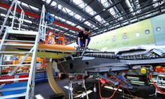 A technician tests the wing of an Airbus A320 plane at Airbus (Tianjin) Final Assembly Co. Ltd in Tianjin, north China, March 16, 2010. [Xinhua photo]