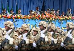 Iranian President Mahmoud Ahmadinejad (C back) reviews the forces during the Army Day celebration in Tehran, Iran, April 18, 2010. Mahmoud Ahmadinejad said here on Sunday that the interference of foreigners served the root cause of all tensions and divisions in the region, demanding foreign forces to leave the region. [Xinhua] 