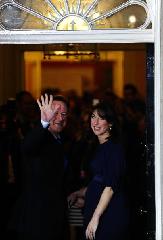 Britain's new Prime Minister Conservative party leader David Cameron (L) and his wife Samantha arrive at 10 Downing Street in London, on May 11, 2010. Cameron was appointed by Britain's Queen Elizabeth II as new prime minister. 