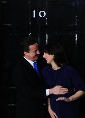 Britain's new Prime Minister Conservative party leader David Cameron (L) and his wife Samantha arrive at 10 Downing Street in London, on May 11, 2010. Cameron was appointed by Britain's Queen Elizabeth II as new prime minister. 