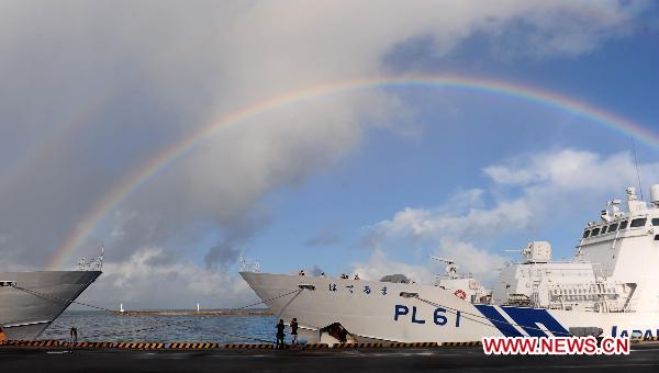 Rainbow is seen near the detained Chinese fishing trawler in Ishigaki Island of Okinawa Prefecture, Japan, Sept. 13, 2010. Fourteen Chinese fishermen detained by the Japanese authorities last week will be released on Monday. [Ji Chunpeng/Xinhua]