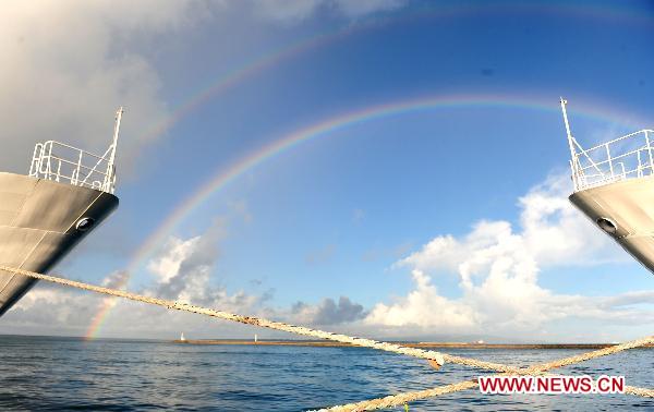 Rainbow is seen near the detained Chinese fishing trawler in Ishigaki Island of Okinawa Prefecture, Japan, Sept. 13, 2010. [Ji Chunpeng/Xinhua]