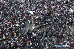 Demonstrators gather near the main Tahrir Square in Cairo, Egypt, Jan. 29, 2011. Tens of thousands of Egyptians defied a curfew and remained on the streets of downtown Cairo on Saturday, demanding the ouster of President Hosni Mubarak. [Cai Yang/Xinhua]