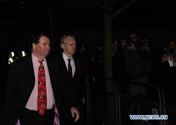 Julian Assange (R), founder of the website Wikileaks, leaves the court with his lawyer Mark Stephens after the final hearing about whether he will be extradited to Sweden, at the Belmarsh Magistrates' Court in southeastern London, Britain, Feb. 8, 2011.