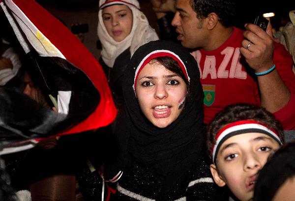 People celebrate the resignation of Egyptian President Hosni Mubarak on Tahrir Square in Cairo, Egypt, Feb. 11, 2011. Egypt's President Hosni Mubarak steps down and the military take charge of the country, Egypt's Vice President Omar Suleiman said on Friday afternoon. [Xinhua photo]