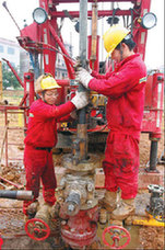 Workers at a natural-gas field in Lianyuan, a city in Central China's Hunan province. China is using more natural gas as it works to reduce its emissions.[China Daily]