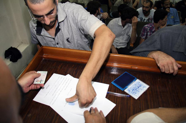 Freed detainees are seen upon their release in the Damascus Police Command in Damascus, Syria on 11 July 2012. The Syrian authorities released Tuesday a total of 275 detainees, who had been arrested over involvement with the anti-government movement, in a bid to show a good will to bring an end to the ongoing crisis at a time the opposition rejected Tuesday dialogue with the Syrian leadership.