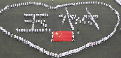 Tianjin: Students from Tianjin Medical University stand in a heart shape while praying for the quake victims in Yushu prefecture of China’s Northwest Qinghai province on April 21, 2010. 